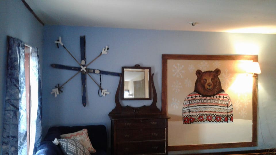 Hand painted bear mural .This bedroom has 2 full beds and private bath