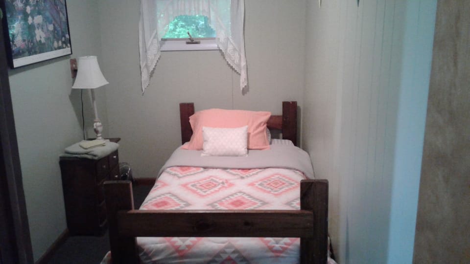 Butterfly bedroom has twin bed and shares a bath