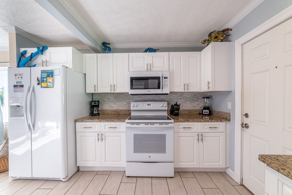 Keurig, drip coffee maker, blender, toaster provided.