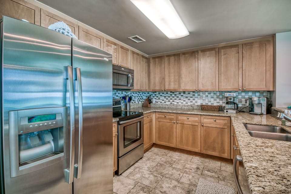 Fully equipped kitchen with stainless steel appliances and large pantry