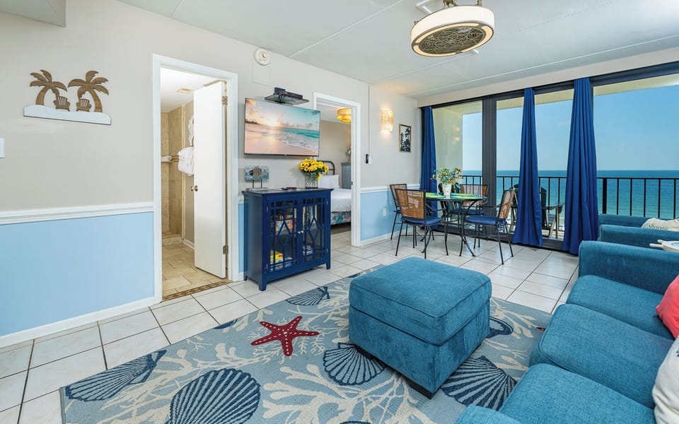 Relax in the inviting living area, where coastal decor enhances your enjoyment of time with family and friends