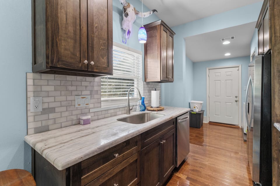 Modern kitchen. Stocked with dishes and cookware