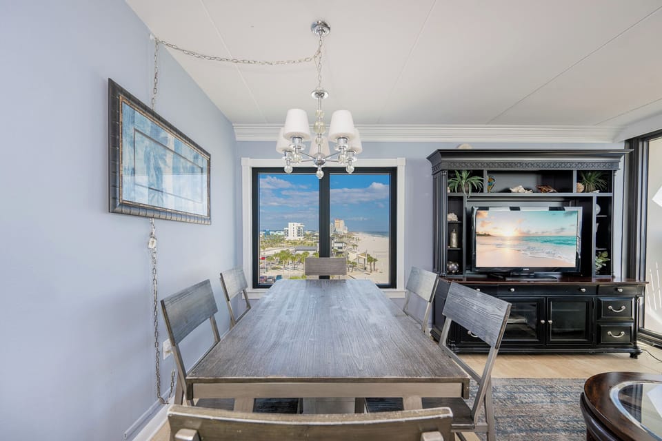 Gather around the sleek dining table and enjoy laughter and conversation while taking in the coastal views