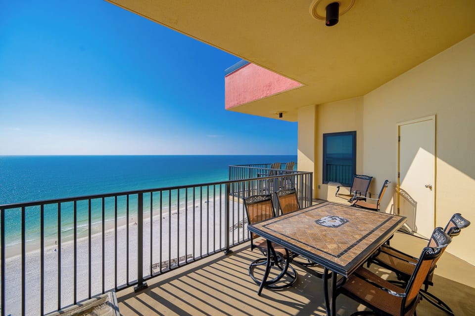 Tile-topped balcony table invites you to relax and savor the cool sea breeze on your balcony