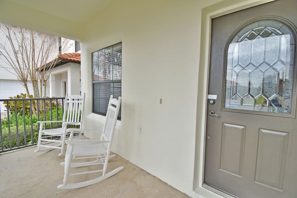 Front entrance showing porch with rocking chairs