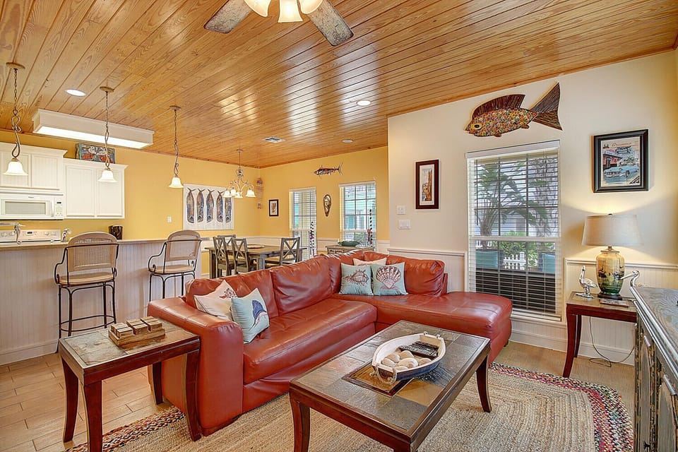 Living Area - The kitchen, dining, and living areas blend seamlessly for a bright and airy feel