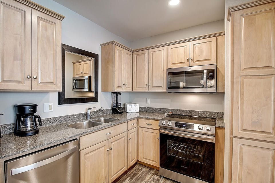 Your fully equipped kitchen awaits with granite counters, stainless appliances, and everything needed to create memorable meals during your stay.