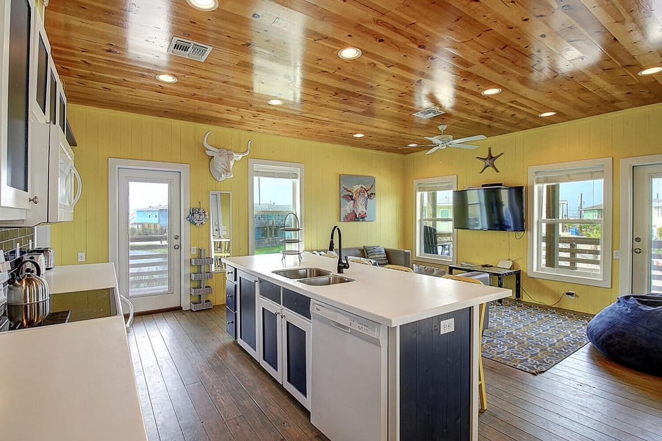 Your spacious open-concept kitchen features rustic wood ceilings, modern appliances, and plenty of natural light for memorable meal prep.