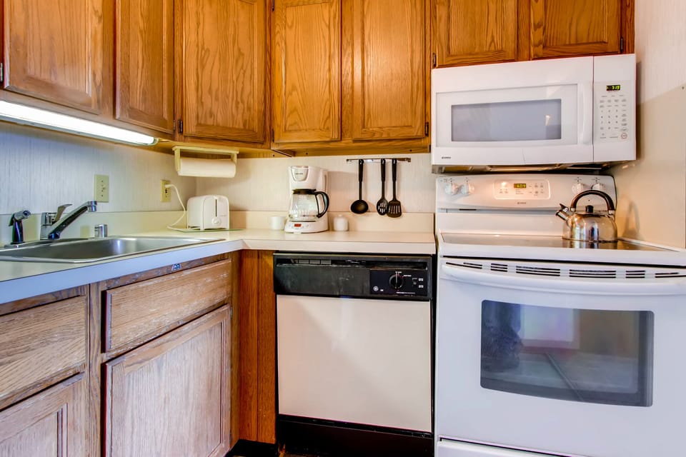 The kitchen w/ upgraded microwave and stove