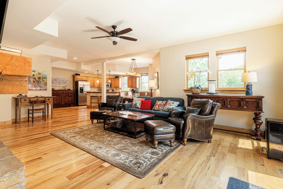 Great Room with Living Room, Dining Area and Kitchen with Beautiful Hardwood Floors Throughout