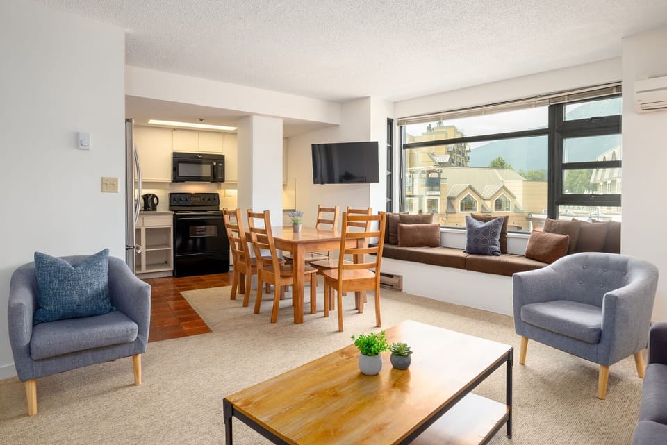 Enjoy meals or game nights at the dining table with village views.