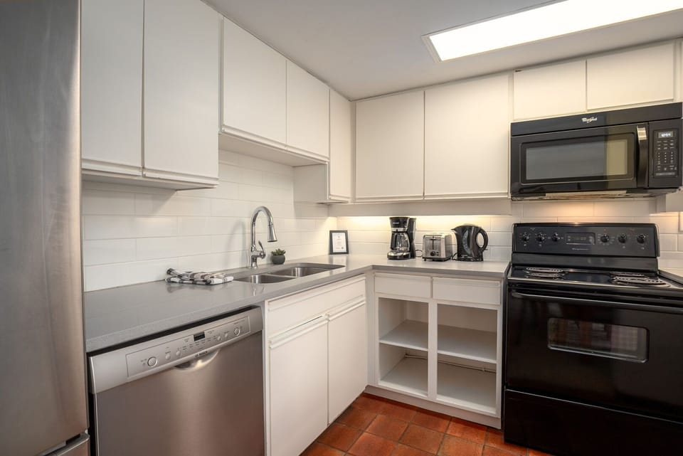 The fully equipped kitchen offers everything you need to prepare home-cooked meals during your stay.