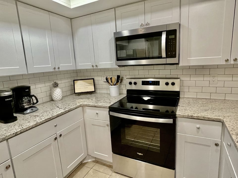 Our coastal kitchen has brand new appliances and granite counter tops.