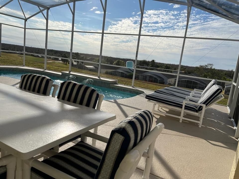 Relax and enjoy the golf course views from pool