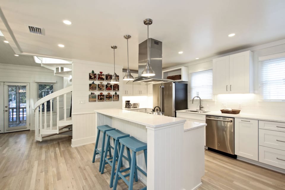 STUNNING KITCHEN WITH STAINLESS APPLIANCES AND BAR SEATING