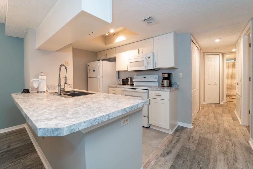 Galley stile kitchen with all you need to prepare most meals in house