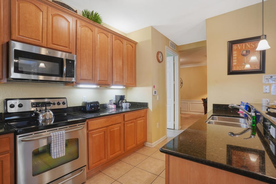 The kitchen  is a testament to sleek design and functionality. With its clean lines, state-of-the-art appliances, and minimalist aesthetics, it offers guests a stylish and efficient space to unleash their culinary creativity.