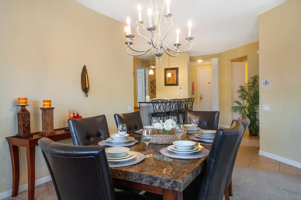 The dining area, spacious enough to accommodate six, sets the stage for elegant gatherings and cherished moments shared over delectable meals. A setting where laughter flows as freely as the conversation, creating memories to treasure.