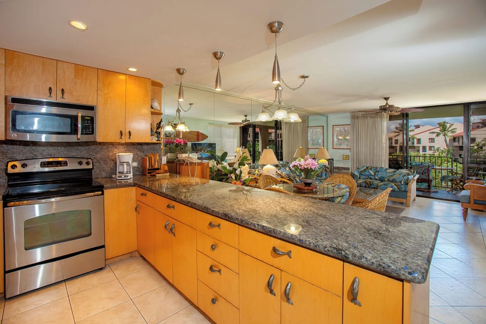 Picture yourself preparing your favorite meals in this bright, fully equipped kitchen, then stepping out to the lanai to enjoy tropical breezes and island living at its finest.