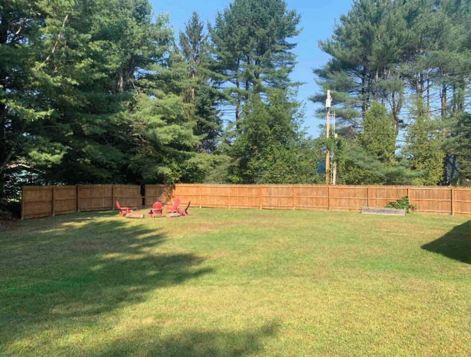 Large fenced in private yard with Firepit and grill