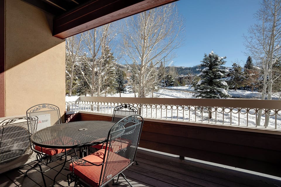 Step onto your private balcony where mountain views and winter wonderland scenery create the perfect alpine retreat backdrop.