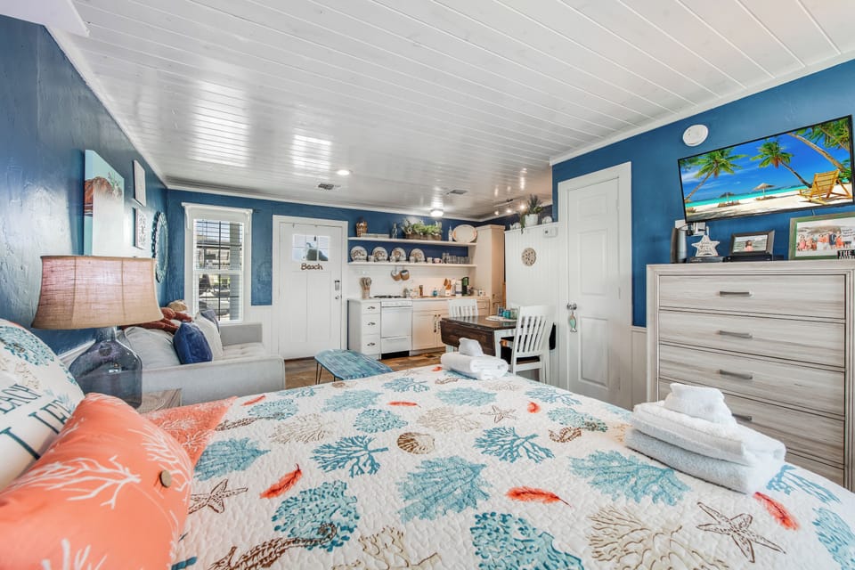 Drift off in this charming beach-themed room with coral reef bedding, ocean-blue walls, and your own kitchenette for morning coffee.