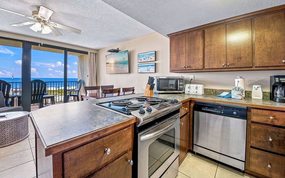 Cook and dine with east in this well-stocked kitchen, featuring sleek stainless steel appliances