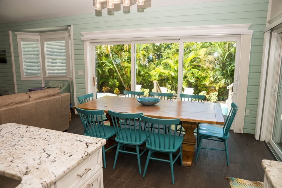 Large dining room table with view of the pool