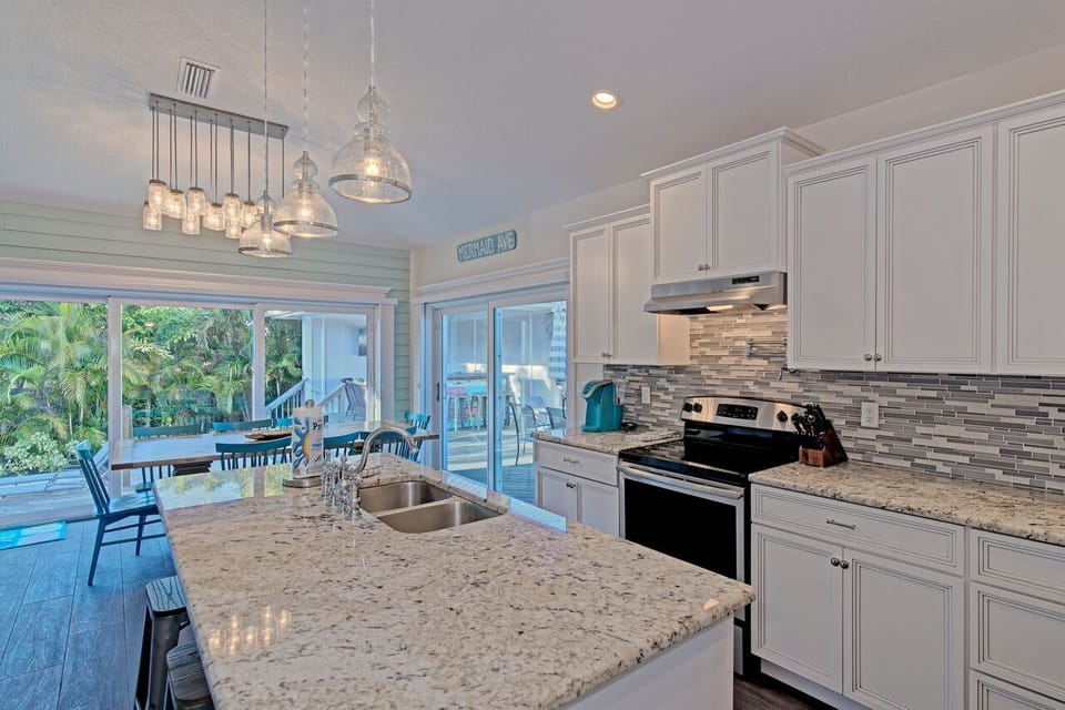 Kitchen with views of outdoor patio