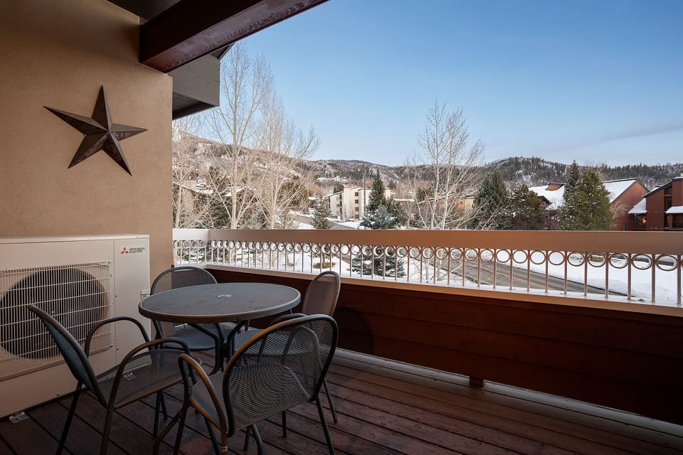 Step onto your private balcony and soak in stunning mountain views while enjoying morning coffee at your outdoor dining table.