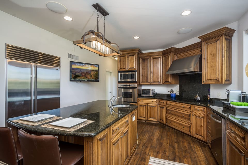 Direct TV in Kitchen, huge Subzero refrigerator.