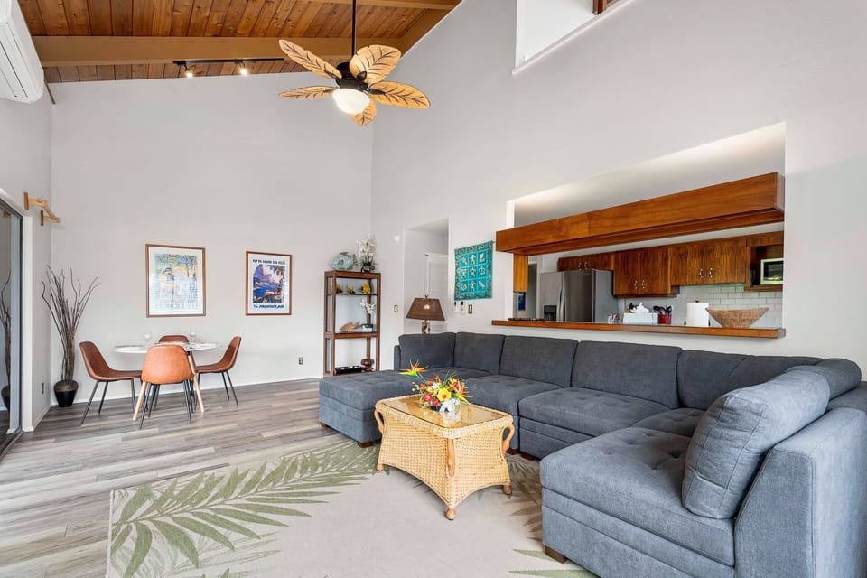The unit is thoughtfully decorated with Hawaiian decor and ceiling fans throughout