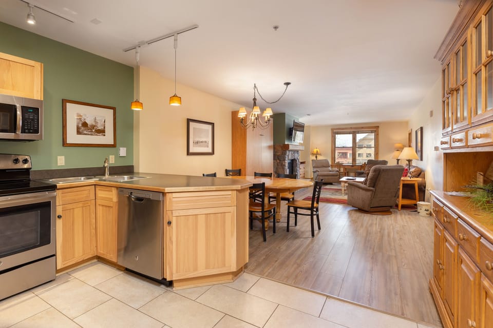 Settle into your spacious open-concept home featuring a fully equipped kitchen, cozy dining area, and comfortable living room with fireplace.