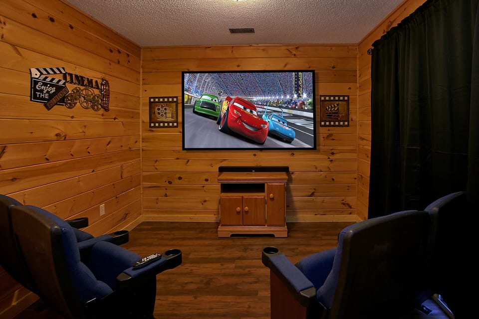 Theater room with theater seating and big screen