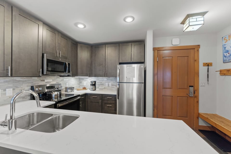 Your modern kitchen features stainless steel appliances, granite countertops, and everything you need to create memorable meals during your stay.