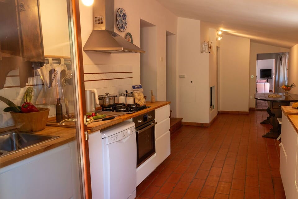 Kitchen, Kitchen Appliance, Countertop, Flooring, Major Appliance, Furniture, Interior Design, Floor, Wood, Cabinetry