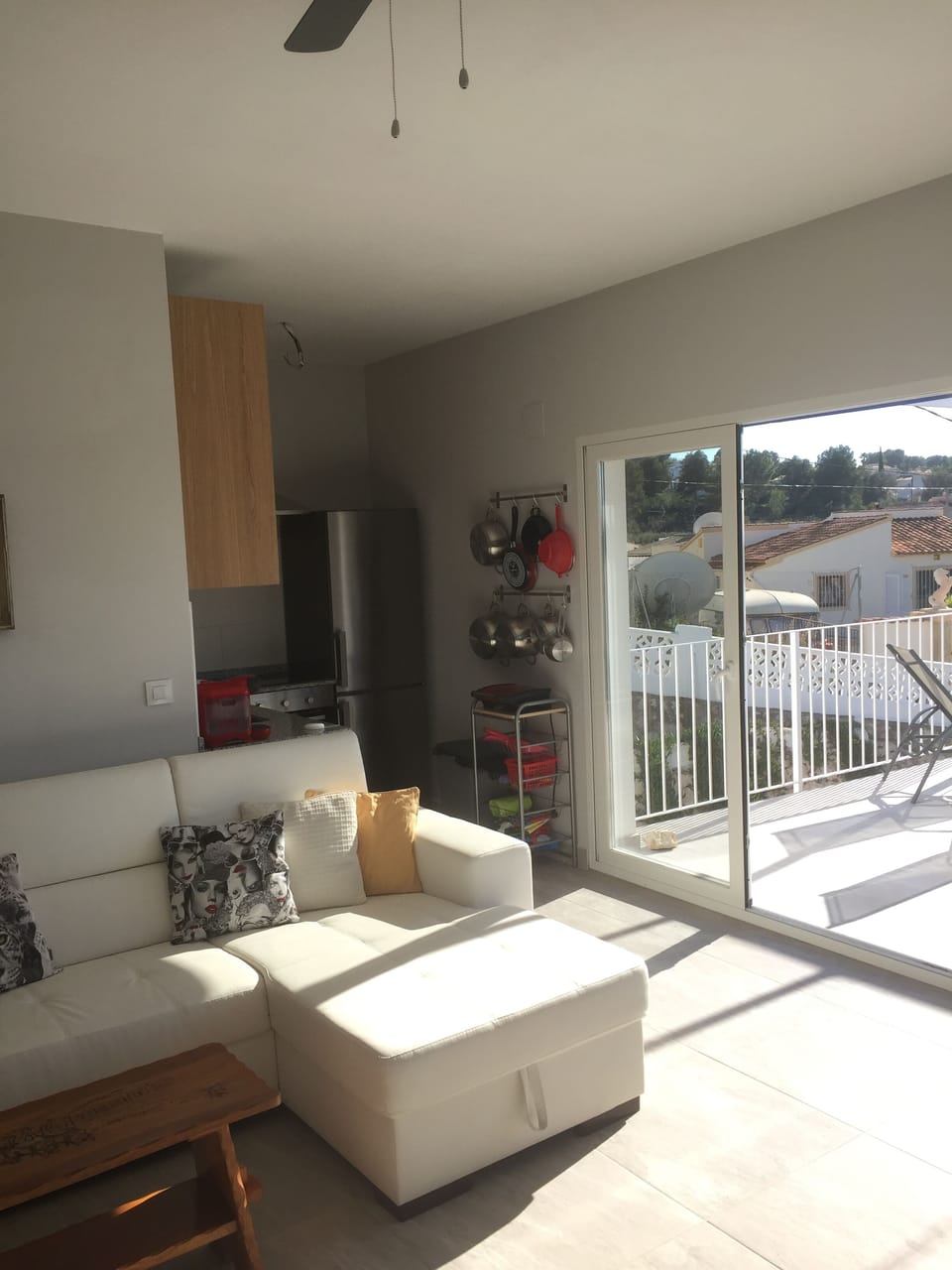 Living room, door to balcony, kitchen to the side 