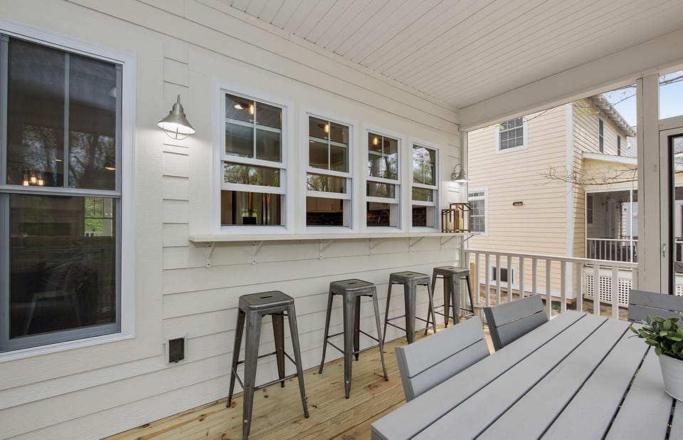 Outdoor Living | Back Screened Porch - Enclosed porch designed with entertaining in mind.  Hand out beverages and snacks using the pass-thru windows from kitchen.