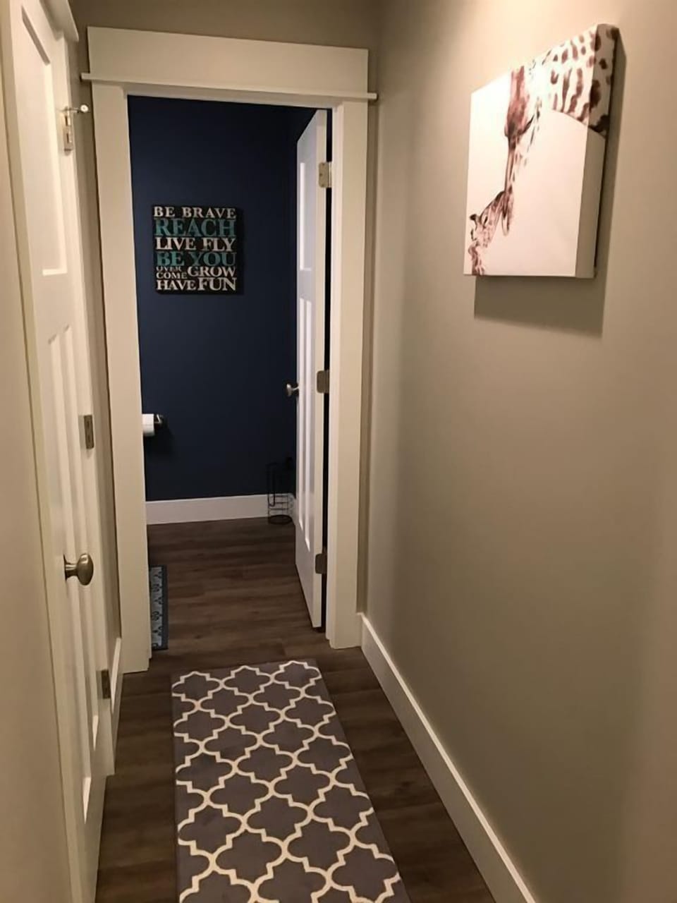 Hallway to 1/2 bath downstairs