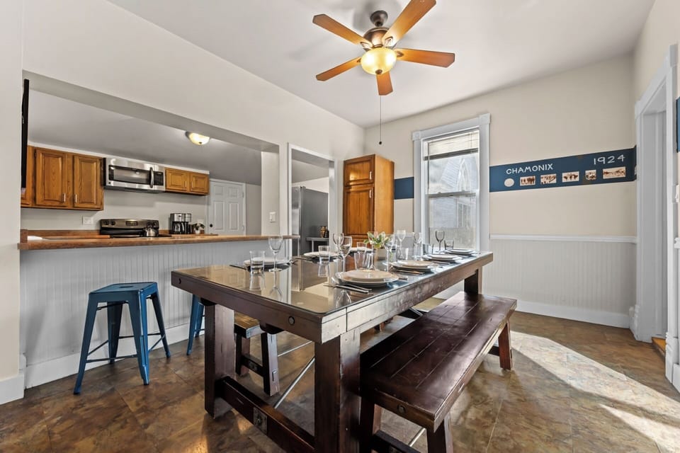 Wood and metal turnbuckle dining table and bench seating for 8