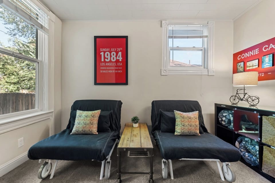 Main level bedroom/den offers two chairs that fold out to twin beds and Smart TV