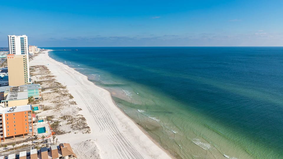 Experience the serene beachfront with gentle waves and soft sand, perfect for relaxation and seaside strolls