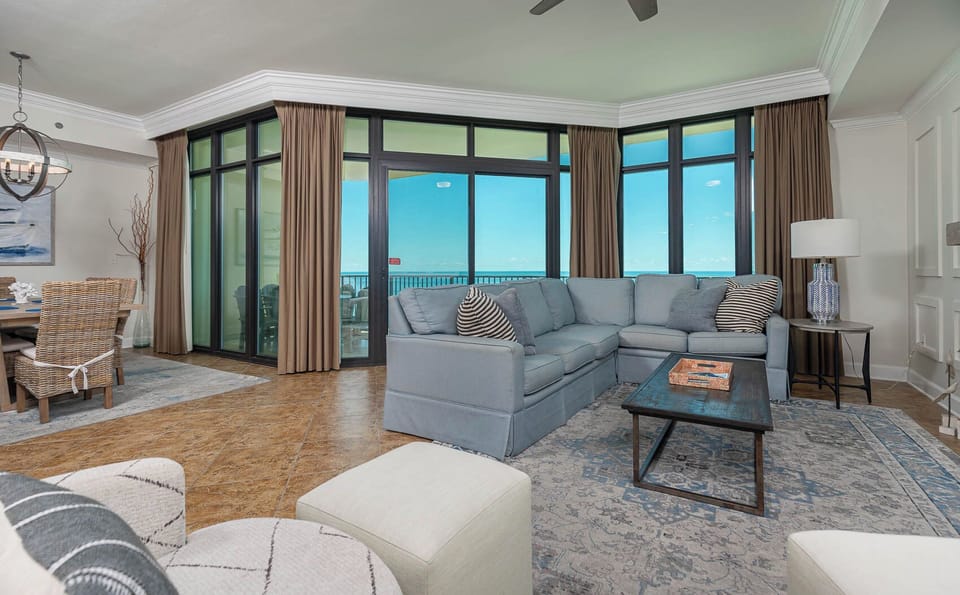Relax on the cozy sofa with a queen sleeper in this inviting family room with breathtaking beachfront views