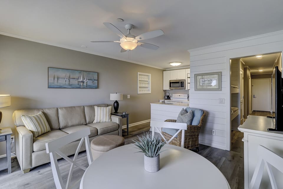 Living room and dining room - This beautifully decorated Oceanfront villa has been totally renovated.

The Living Room has designer furnishings and new wood grain tile flooring.