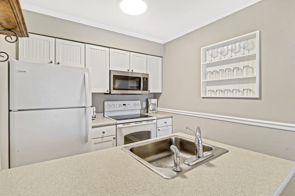 Kitchen - Newly painted full sized kitchen with new microwave and regular drip coffee maker.  Plenty of glassware for all your beverages.