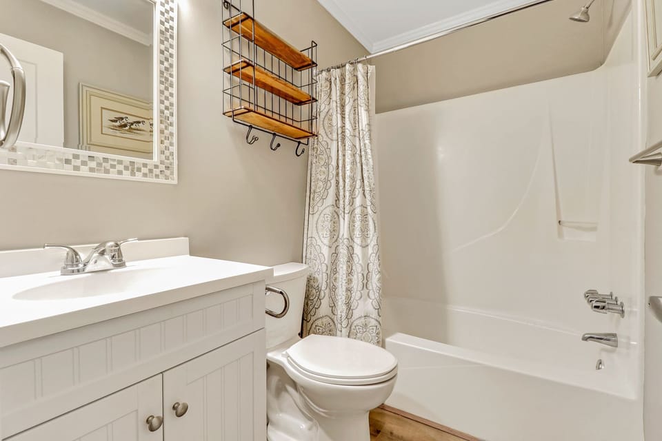 Bathroom - Bright, white, newly renovated bathroom with shower/tub combination