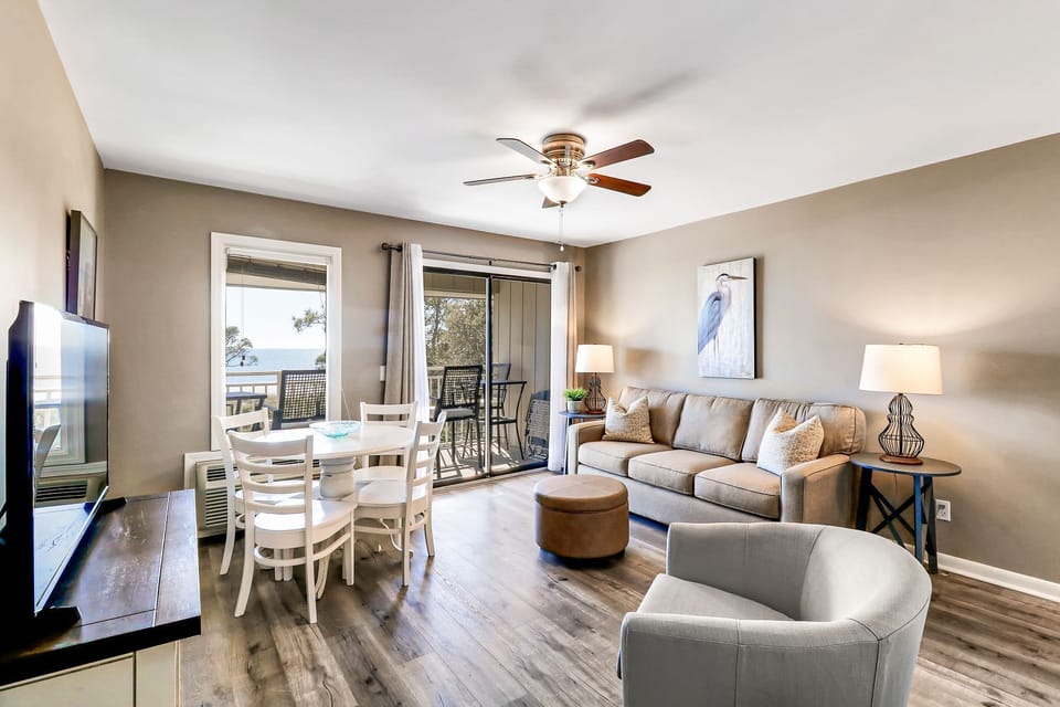 Oceanfront property - Living /dining area - Beautifully renovated space with all new flooring, paint and furniture.