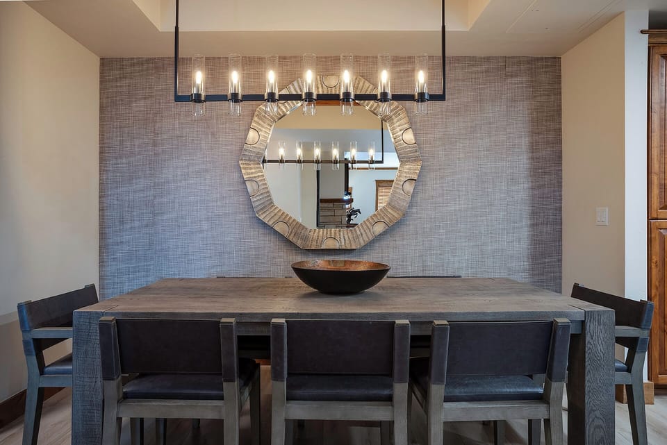 Modern dining space with sleek furnishings and ambient lighting sets the stage for memorable gatherings. You'll appreciate the sophisticated design and comfortable seating for shared meals.