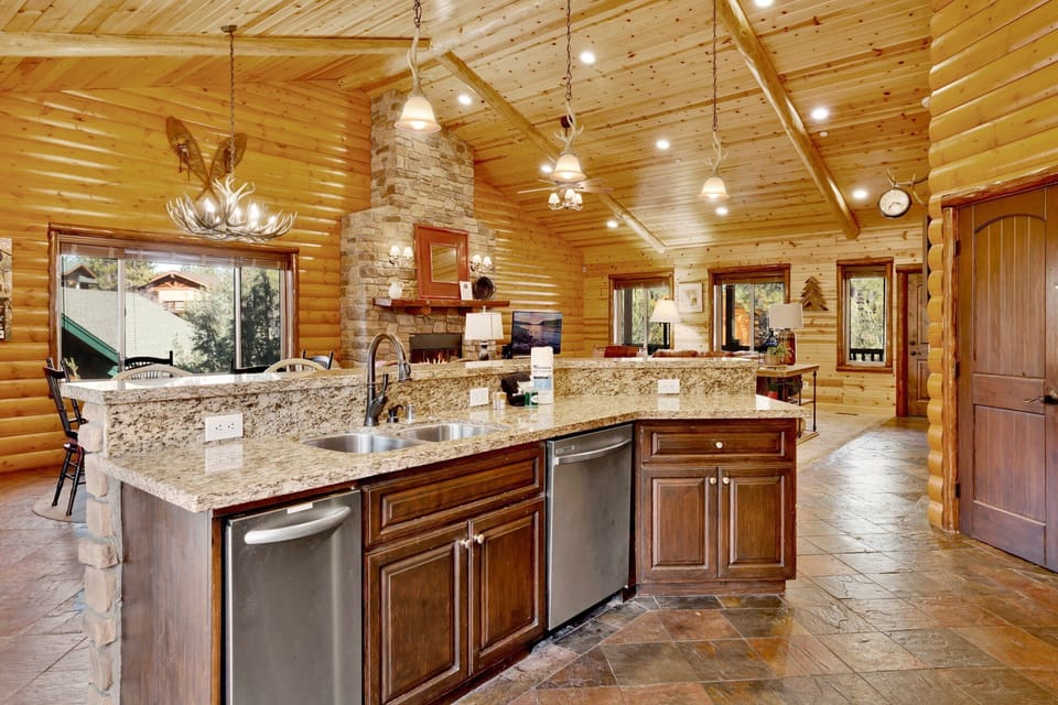 Fully equipped cabin kitchen with ample cabinetry, stove, fridge, microwave, and coffee maker—perfect for cooking meals, morning coffee, and feeling right at home on your stay.