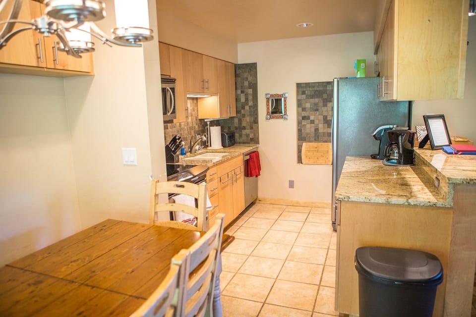 The dining table area looking into the kitchen